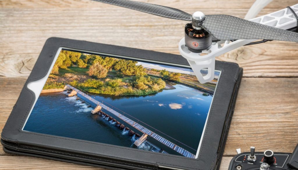 rone tablet view of wooden bridge over coastal waterway - FAA certified drone videography Baldwin County