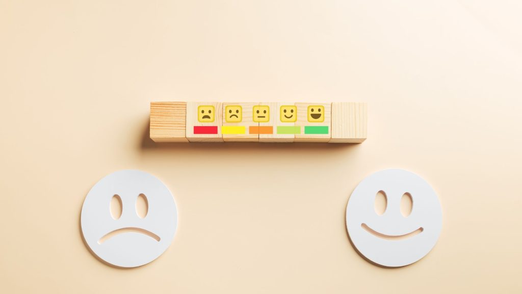 a smiley and frowny face indicating uswer experience